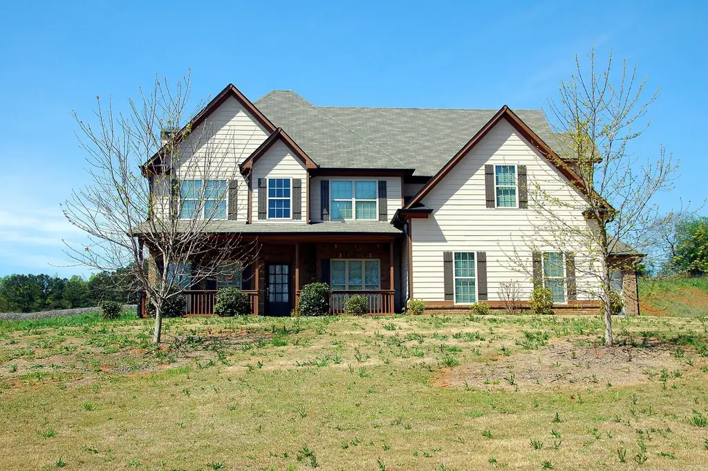 Two-story suburban home with a large front lawn
